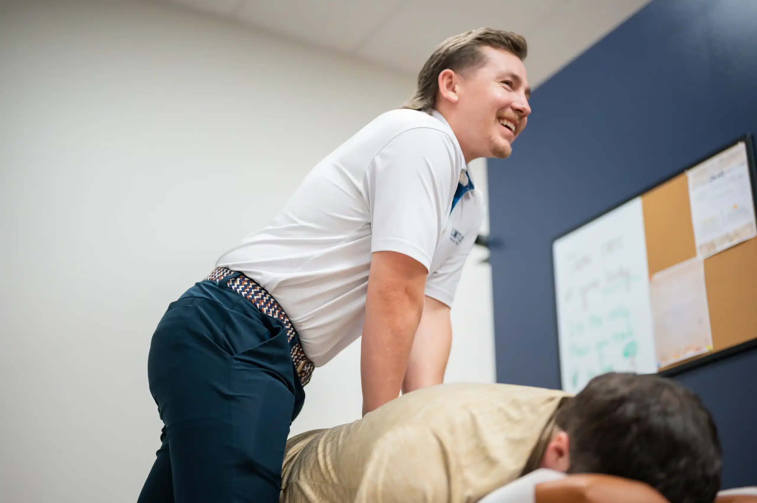 Chiropractic services at Limitless Chiropractic with Dr. Seth Little performing a spinal adjustment