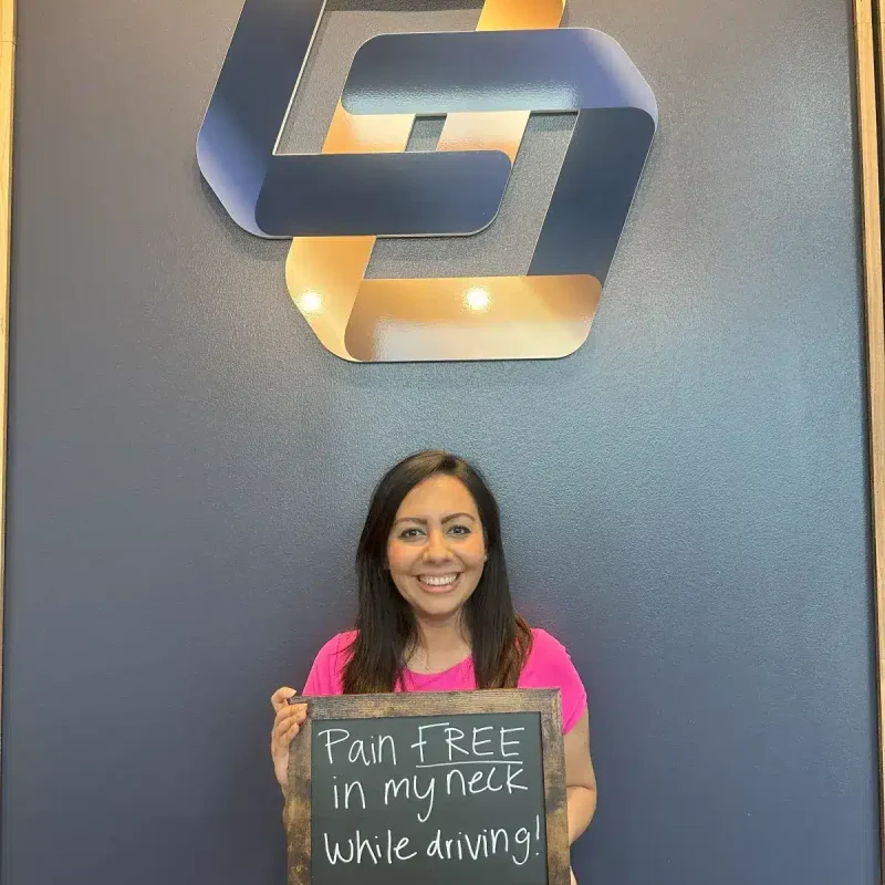 Female patient delighted to be "Pain FREE in my neck while driving!" after treatment from her chiropractor in Alliance, also serving North Fort Worth.