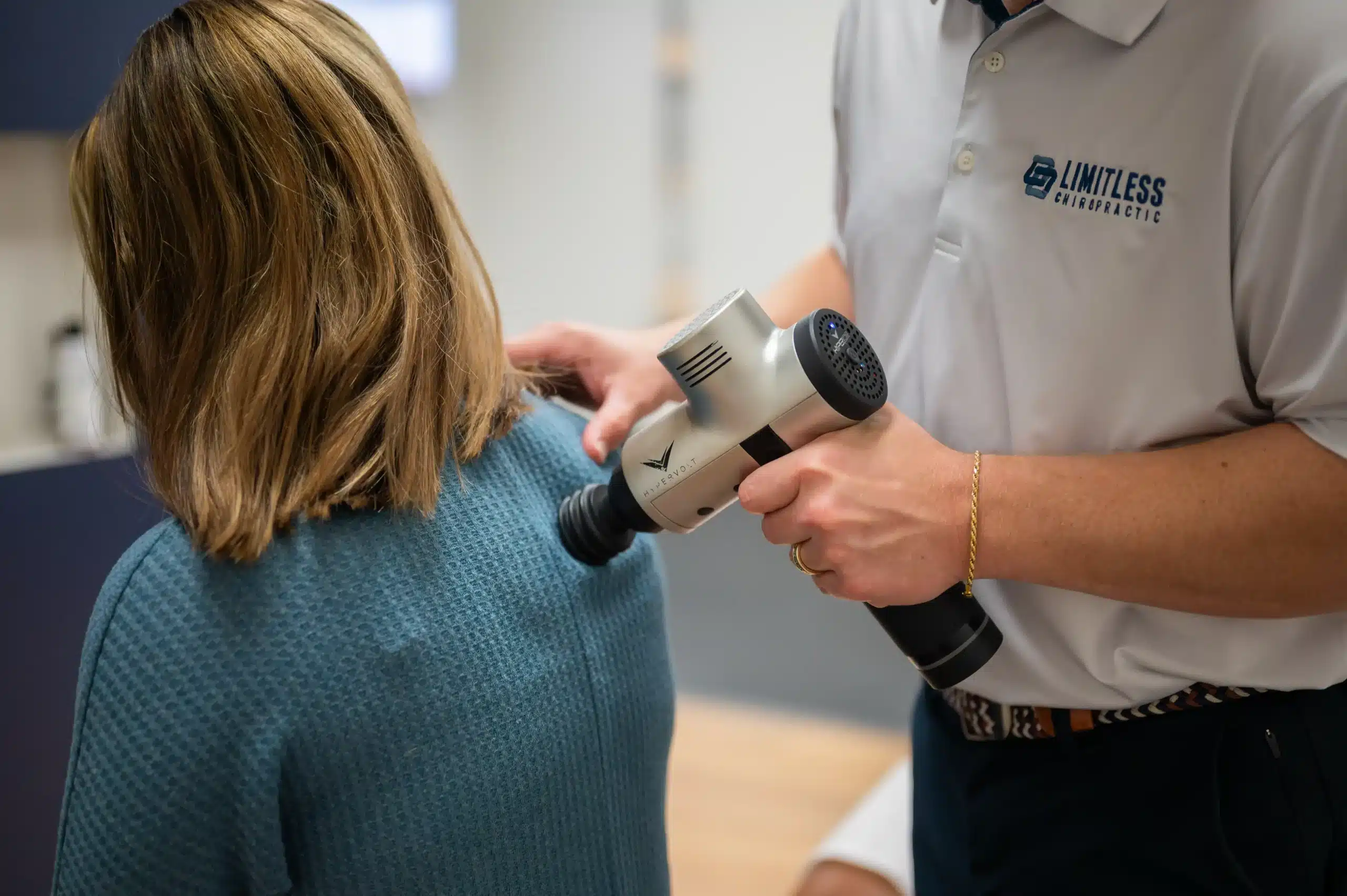 Soft tissue therapy at Limitless Chiropractic using targeted muscle treatment to relieve tension and pain
