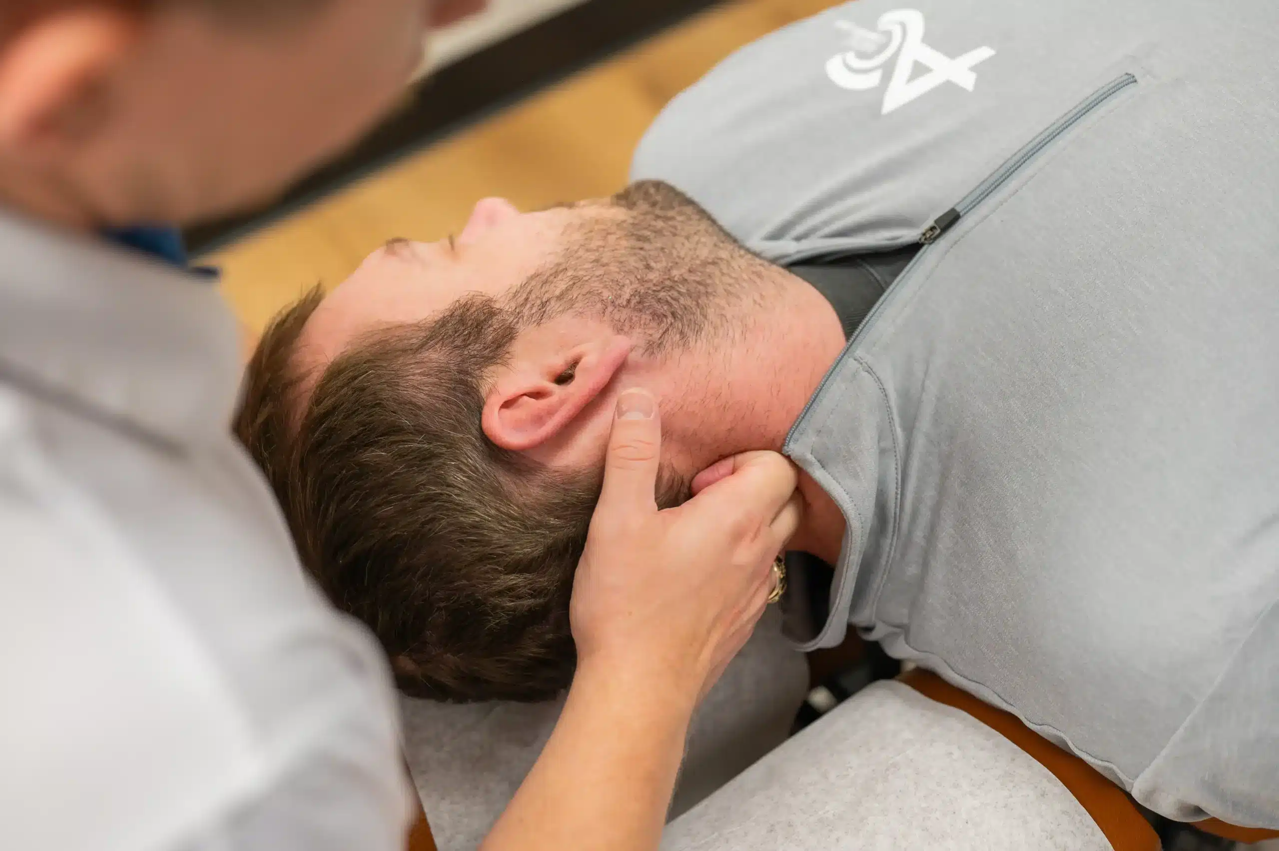 Soft tissue therapy for neck pain performed by Dr. Seth Little at Limitless Chiropractic